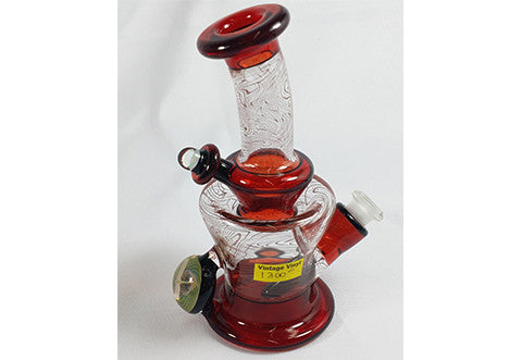 Nish Transparent With Red Swirl and Markings Bottle Rig